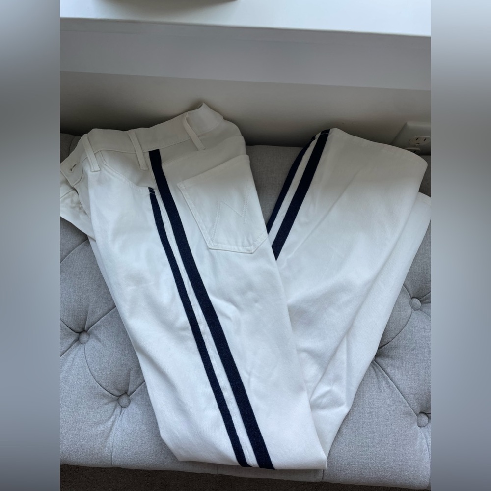Mother white bootcut jeans with sparkly navy stripes down side of legs. Size 26.